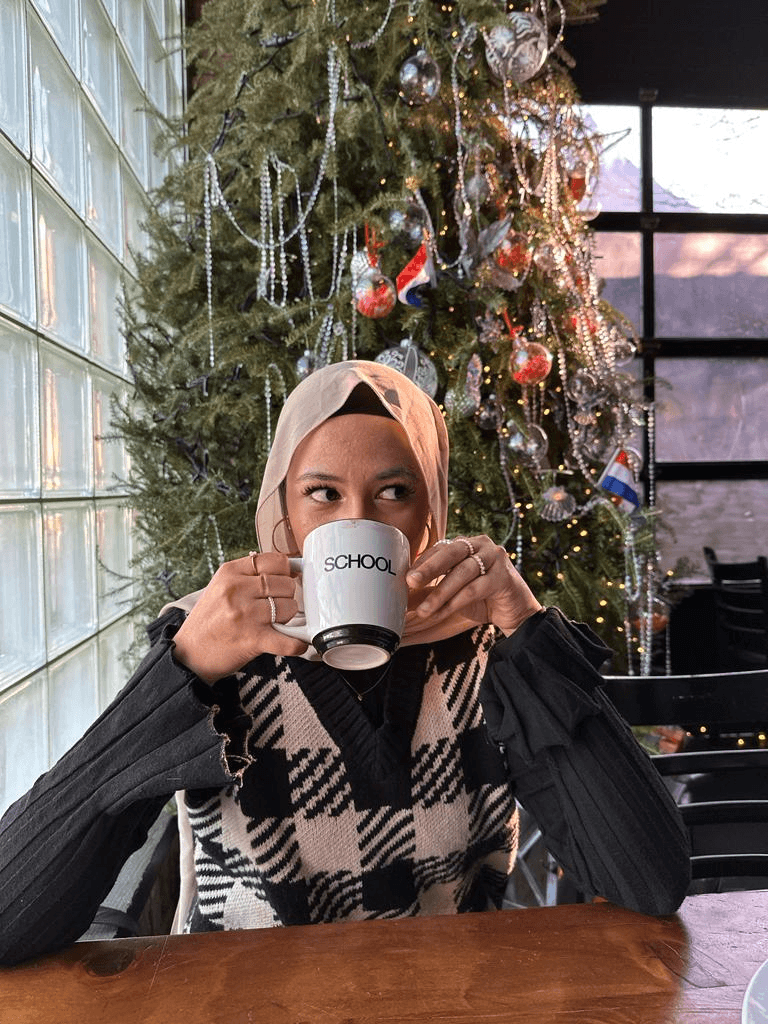 Khadija enjoying some coffee and brunch.